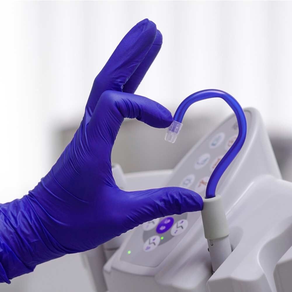 dental-professional-wearing-trufit-violet-ultra-thin-nitrile-gloves Young Innovations
